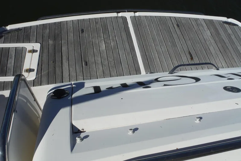 Slide: The Image of 2008 Regal Commodore 3760 IO boat with wooden deck and railing. - 26