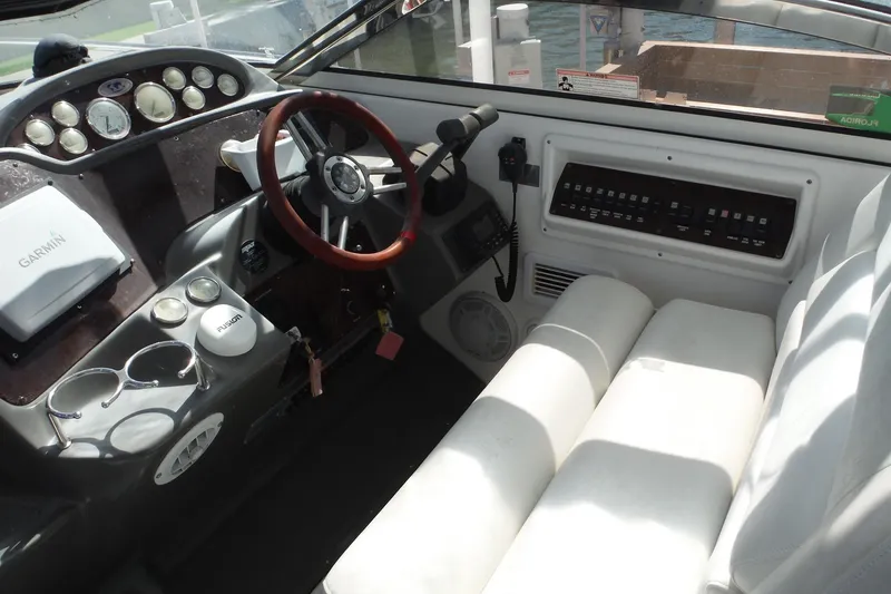 Slide: The Image of Interior cockpit of 2008 Regal Commodore 3760 IO boat with steering wheel and control panel. - 39