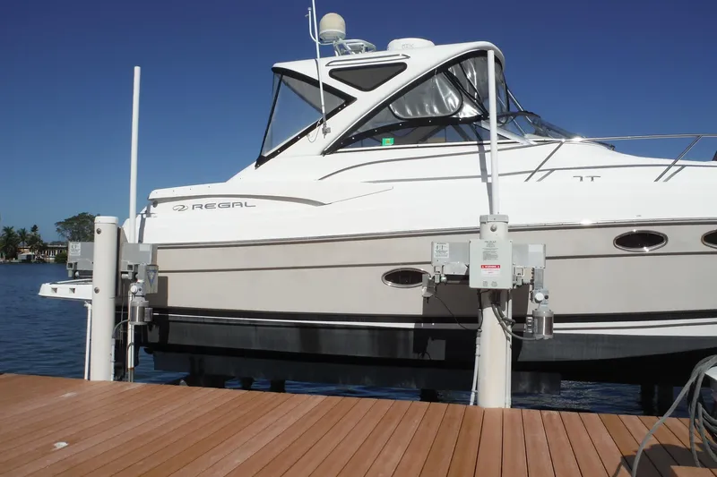 Slide: The Image of 2008 Regal Commodore 3760 IO boat docked on a sunny day. - 4