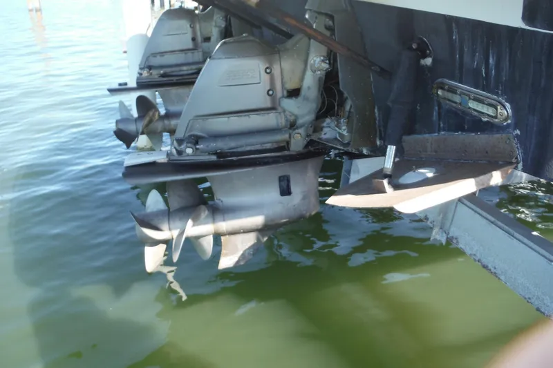 Slide: The Image of 2008 Regal Commodore 3760 IO boat propellers and stern drive in water. - 43
