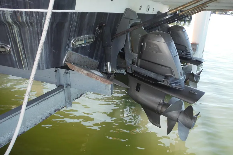 Slide: The Image of 2008 Regal Commodore 3760 IO boat with dual outboard motors in water. - 45