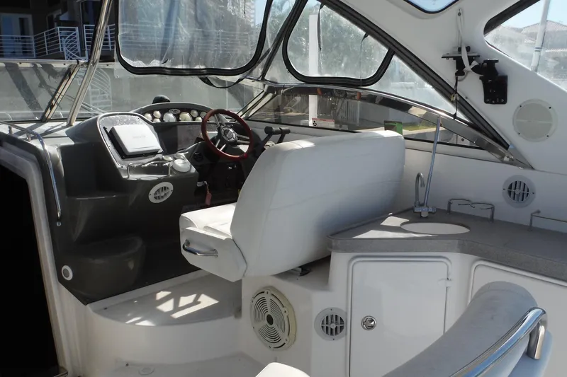 Slide: The Image of 2008 Regal Commodore 3760 IO boat interior with helm, seating, and dashboard. - 9