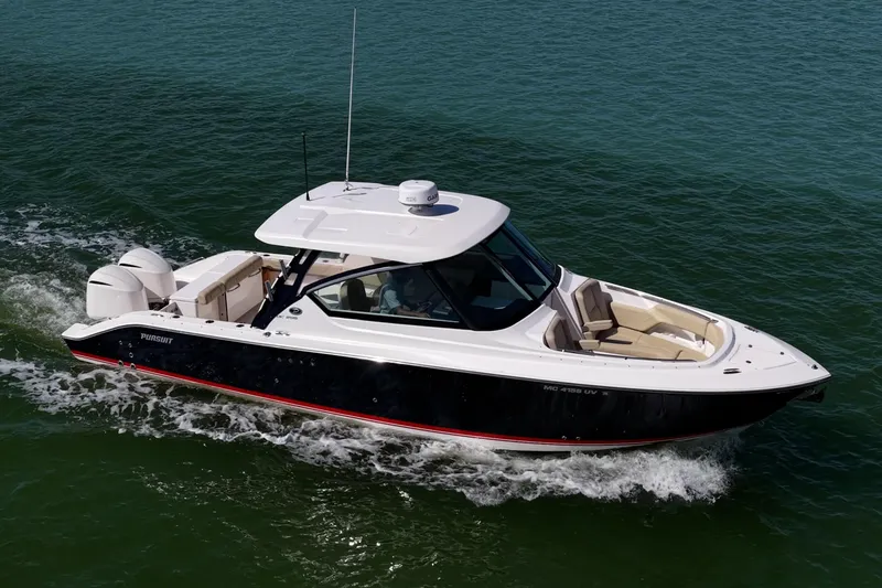 Slide: The Image of 2017 Pursuit DC 295 Dual Console boat cruising on open water. - 53