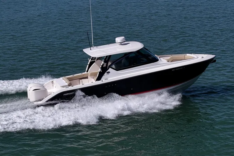 Slide: The Image of 2017 Pursuit DC 295 Dual Console boat cruising on open water. - 57