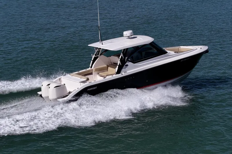 Slide: The Image of 2017 Pursuit DC 295 Dual Console boat cruising on open water. - 58