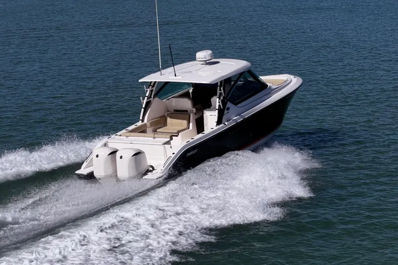 Slide: The Image of 2017 Pursuit DC 295 Dual Console boat cruising on open water. - 59