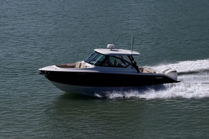 Slide: The Image of 2017 Pursuit DC 295 Dual Console boat cruising on water. - 63