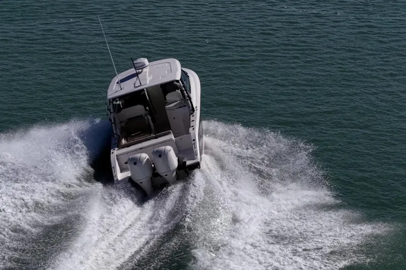 Slide: The Image of 2017 Pursuit DC 295 Dual Console boat cruising on open water. - 67