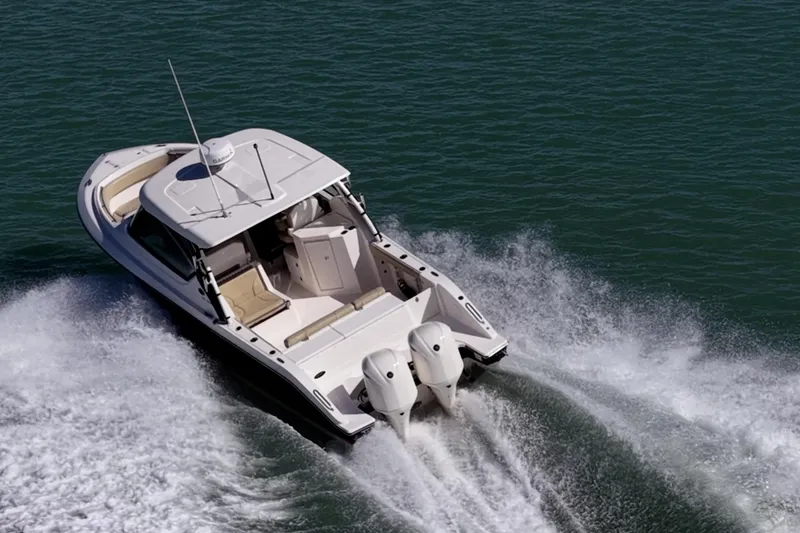 Slide: The Image of 2017 Pursuit DC 295 Dual Console boat cruising on open water. - 68