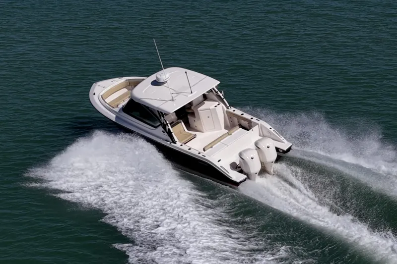 Slide: The Image of 2017 Pursuit DC 295 Dual Console boat cruising on open water. - 69