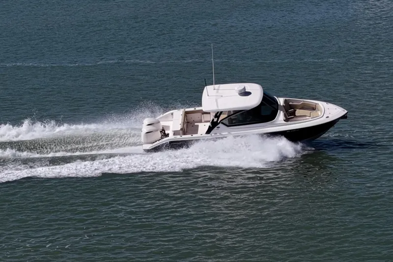 Slide: The Image of 2017 Pursuit DC 295 Dual Console boat cruising on open water. - 71