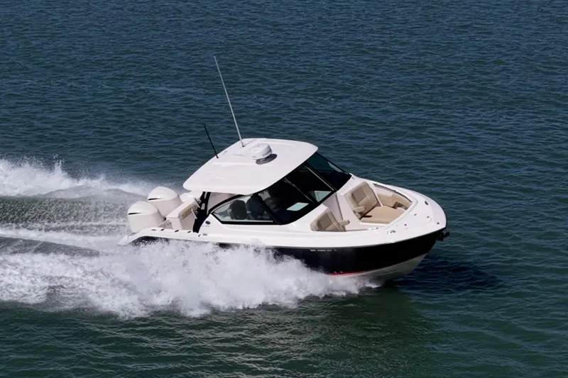 Slide: The Image of 2017 Pursuit DC 295 Dual Console boat cruising on open water. - 72