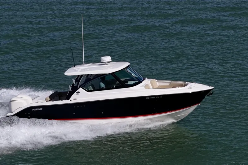 Slide: The Image of 2017 Pursuit DC 295 Dual Console boat cruising on open water. - 75