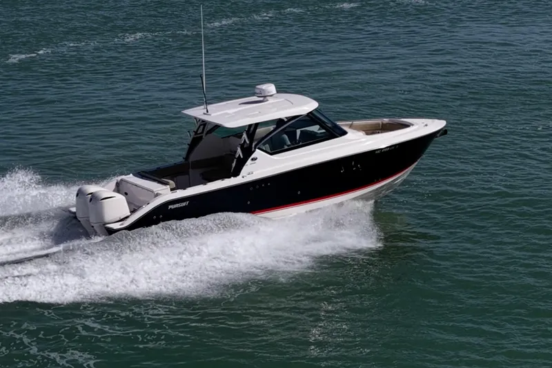 Slide: The Image of 2017 Pursuit DC 295 Dual Console boat cruising on open water. - 76