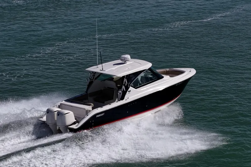 Slide: The Image of 2017 Pursuit DC 295 Dual Console boat cruising on open water. - 77
