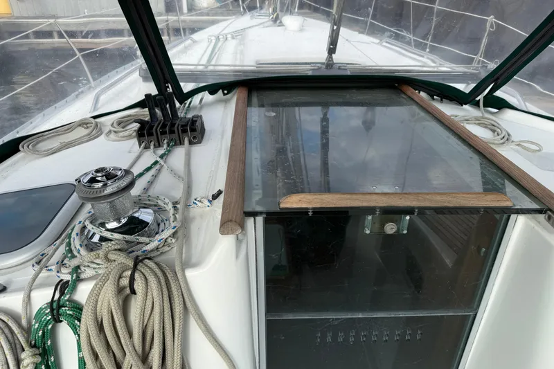 Slide: The Image of Cockpit view of a 2000 Beneteau 361 sailboat with ropes and winch. - 26