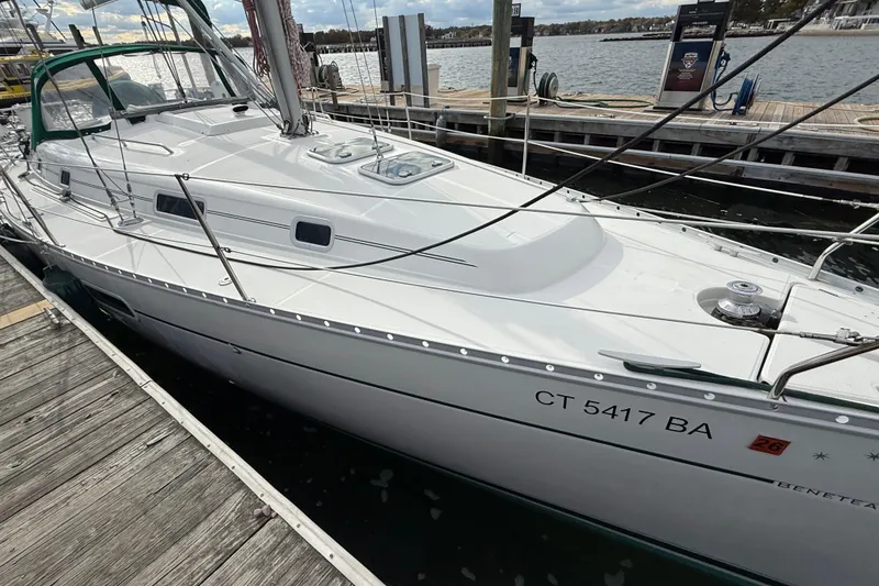 Slide: The Image of 2000 Beneteau 361 sailboat docked at marina, side view. - 27