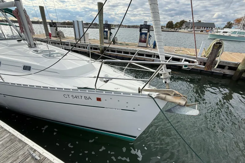 Slide: The Image of Sailboat Beneteau 361, year 2000, docked at marina with scenic waterfront view. - 4