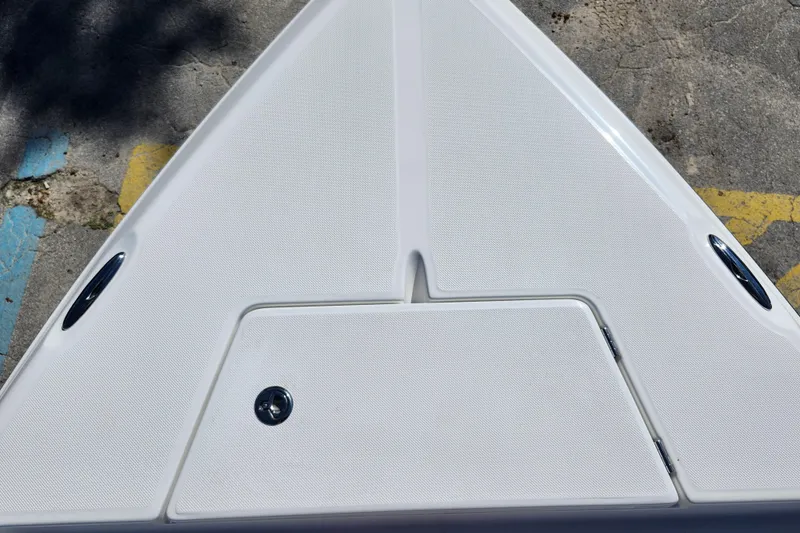 Slide: The Image of Bow of 2026 Savannah 210X boat with sleek white deck design. - 11