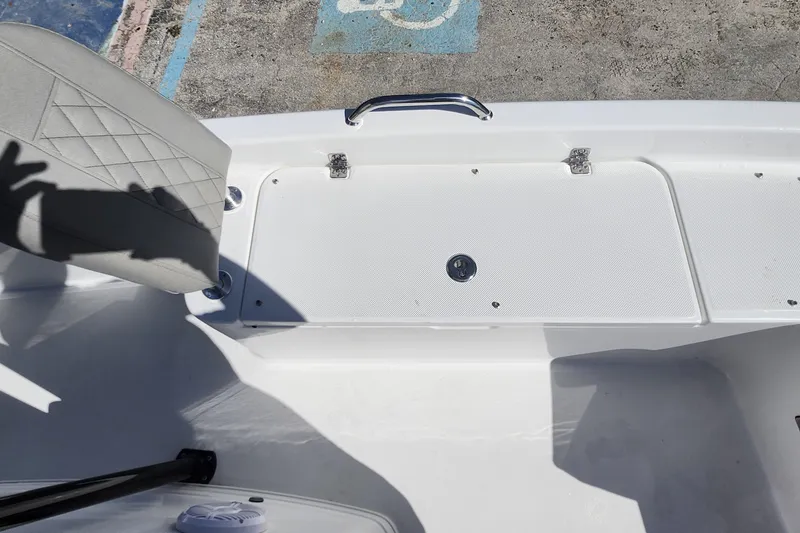 Slide: The Image of 2026 Savannah 210X boat interior with seating and storage compartment. - 17