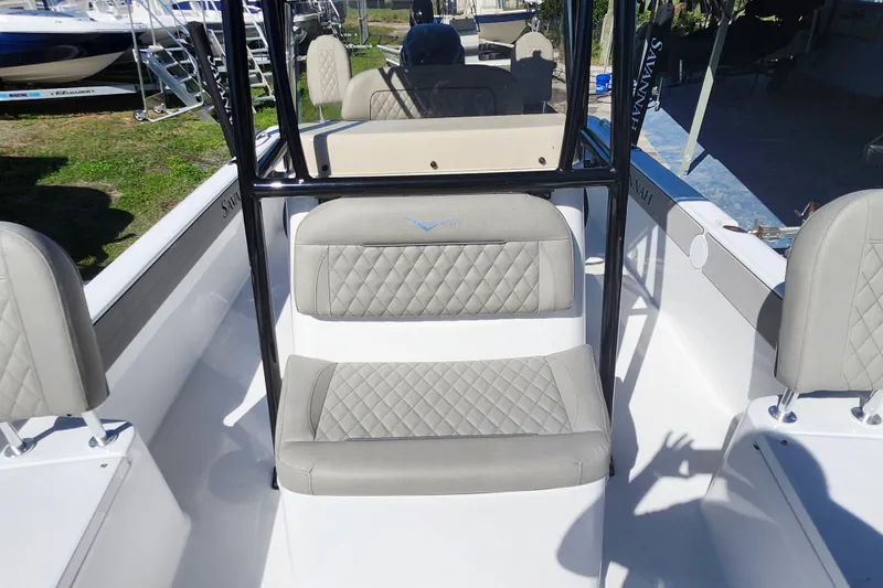Slide: The Image of 2026 Savannah 210X boat interior with gray quilted seats and sleek design. - 19