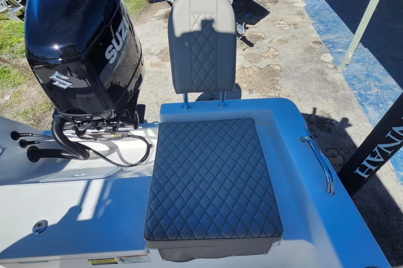 Slide: The Image of 2026 Savannah 210X boat with Suzuki engine and diamond-stitched seating. - 22