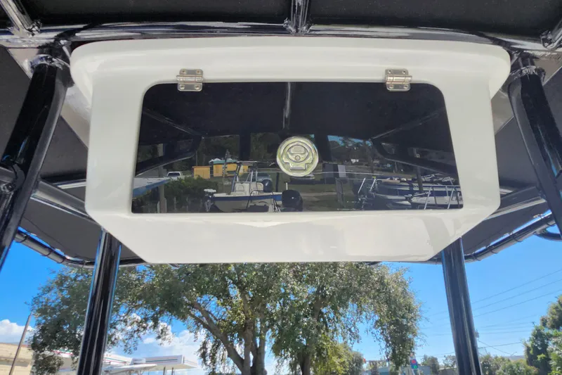 Slide: The Image of 2026 Savannah 210X boat console with storage compartment, outdoor setting. - 38