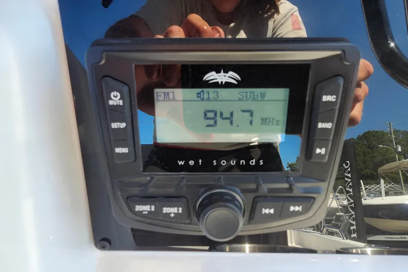 Slide: The Image of Boat stereo system displaying FM radio station 94.7 MHz on a Savannah 210X, 2026 model. - 41
