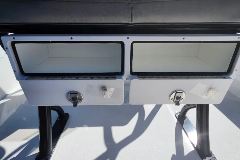 Slide: The Image of Storage compartments on a 2026 Savannah 210X boat, featuring secure latches and sleek design. - 44