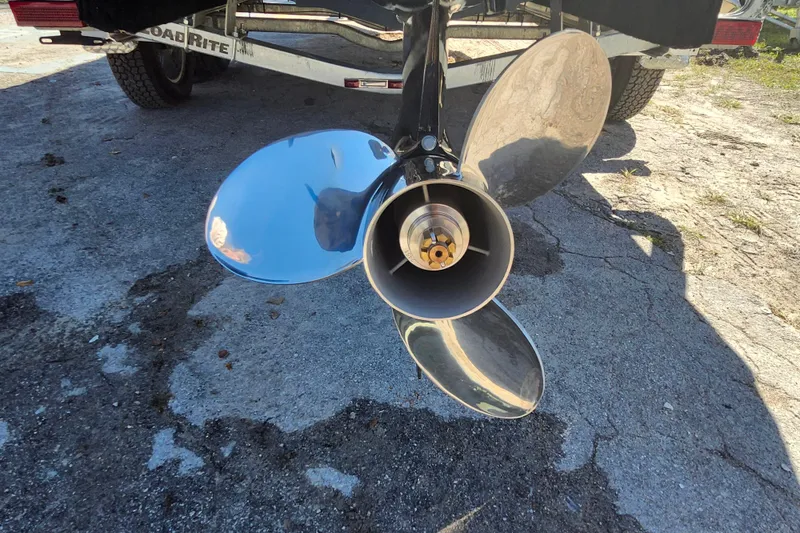 Slide: The Image of Shiny propeller of a 2026 Savannah 210X boat on a trailer. - 7