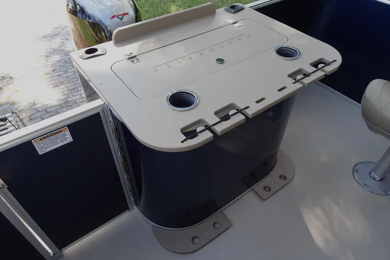 Slide: The Image of 2023 Sylvan Mirage Fish 820 Party Fish boat interior with fishing station and cup holders. - 20