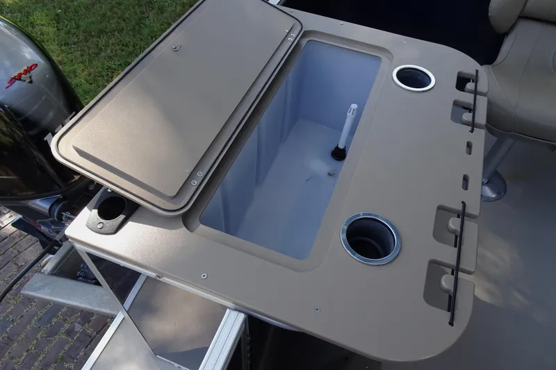 Slide: The Image of 2023 Sylvan Mirage Fish 820 Party Fish boat with open storage compartment and cup holders. - 24