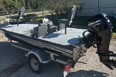 The Image of 2020 Lowe Stinger 175 boat with Mercury engine, parked on a trailer. - 1