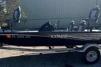 Slide: The Image of 2020 Lowe Stinger 175 boat on trailer, parked outdoors. - 4