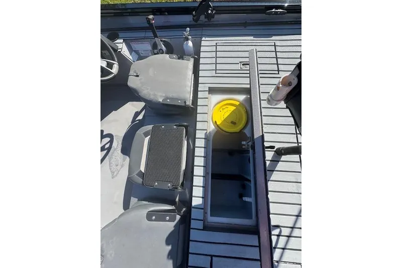 Slide: The Image of 2020 Lowe Stinger 175 boat interior with seating and storage compartment. - 8