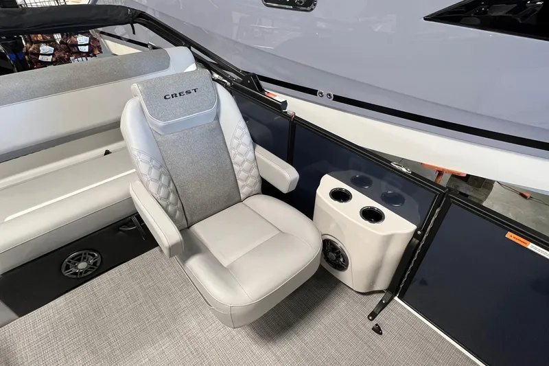 Slide: The Image of Luxurious seating on 2026 Crest Conquest 230 SLSC boat with cup holders and speaker. - 10
