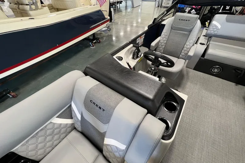 Slide: The Image of 2026 Crest Conquest 230 SLSC boat interior with luxurious seating and modern design. - 16