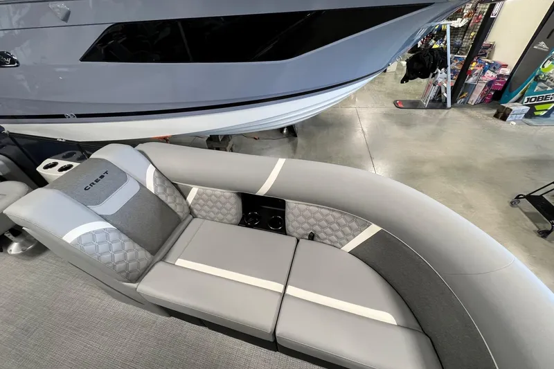 Slide: The Image of 2026 Crest Conquest 230 SLSC boat interior with sleek gray seating and modern design. - 17