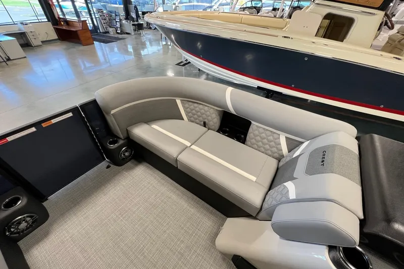 Slide: The Image of 2026 Crest Conquest 230 SLSC boat interior with gray seating and modern design. - 18