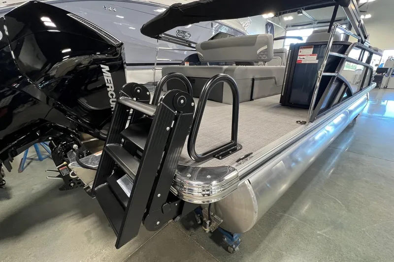 Slide: The Image of 2026 Crest Conquest 230 SLSC pontoon boat with Mercury engine and boarding ladder. - 6