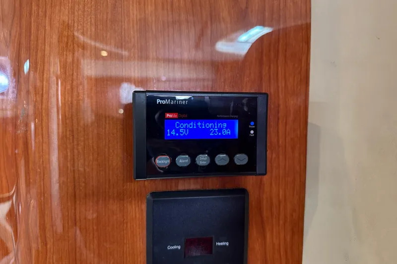 Slide: The Image of ProMariner digital display on 1999 Sea Ray Sundancer 400 yacht, showing voltage and current. - 23