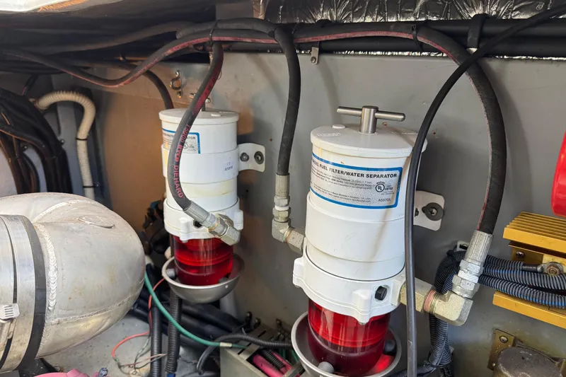 Slide: The Image of Engine room of 1999 Sea Ray Sundancer 400 with fuel filter and water separator system. - 31