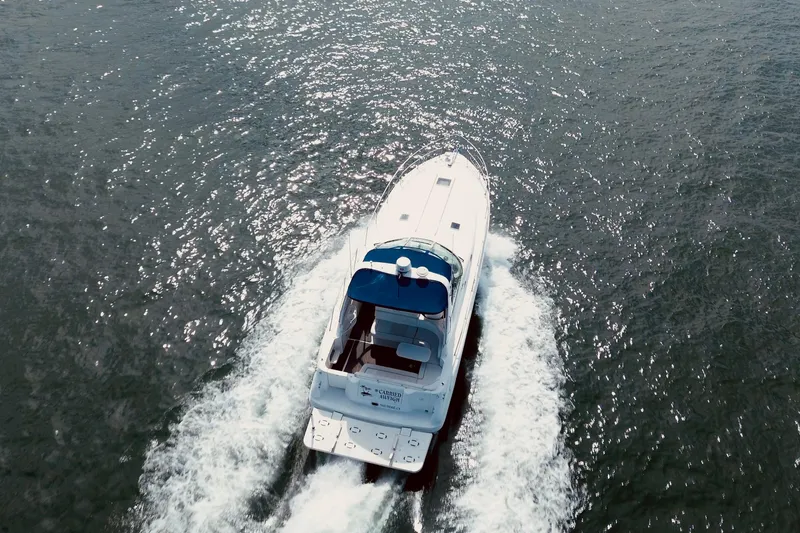 Slide: The Image of Aerial view of 1999 Sea Ray Sundancer 400 cruising on open water. - 4