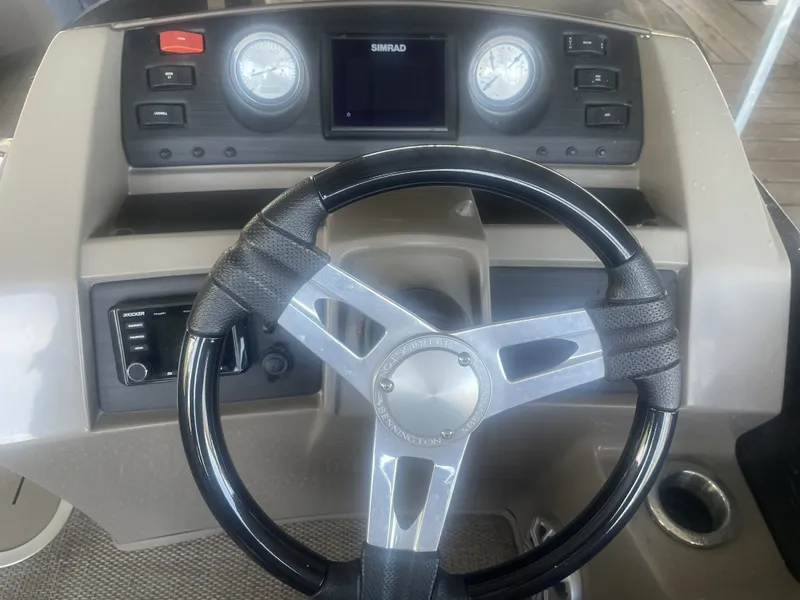Slide: The Image of Steering console of a 2020 Bennington SSRFBXP boat with gauges and controls. - 11