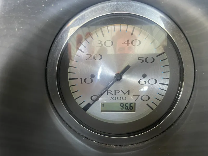 Slide: The Image of Close-up of a Bennington 2020 SSRFBXP RPM gauge displaying 966 RPM. - 19