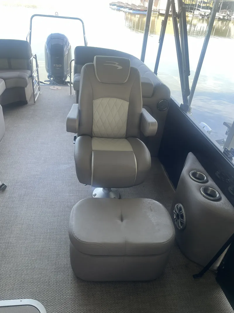 Slide: The Image of 2020 Bennington SSRFBXP boat interior with cushioned seating and Yamaha 150 engine. - 27