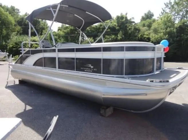 Slide: The Image of 2020 Bennington SSRFBXP pontoon boat with canopy, parked outdoors. - 42