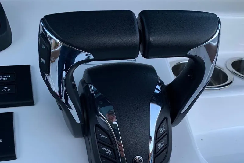 Slide: The Image of Throttle controls on a 2022 Sea Hunt Gamefish 25 boat dashboard. - 10