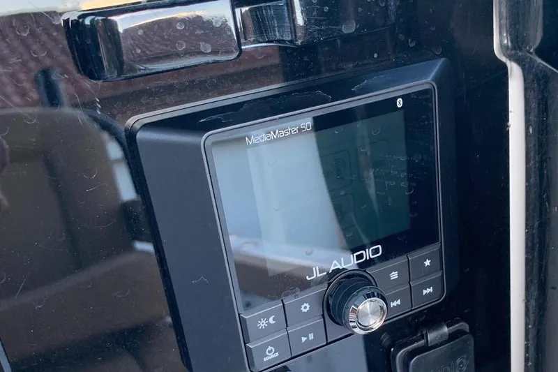 Slide: The Image of JL Audio MediaMaster 50 on 2022 Sea Hunt Gamefish 25 boat dashboard. - 11