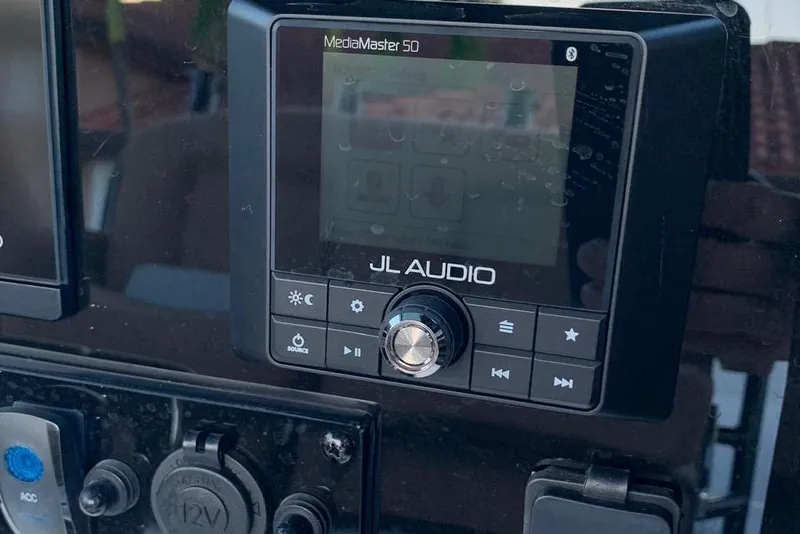 Slide: The Image of JL Audio MediaMaster 50 on 2022 Sea Hunt Gamefish 25 dashboard. - 12